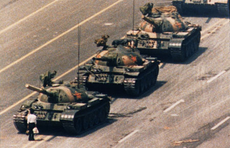 photo: Beijing, China, 4 June 1989. A demonstrator confronts a line of People's Liberation Army tanks during Tiananmen Square demonstrations for democratic reform.