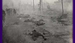 photo: burnt corpses lie in a ruined street