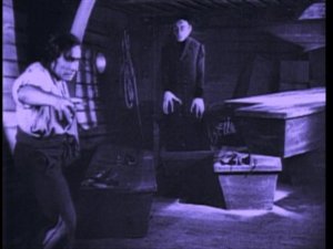 film still: the first mate sees the vampire rising out of his coffin