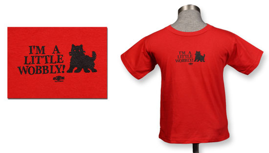 It's a little red and black t-shirt for a toddler, with a cartoon of a black kitten and the words I'm A Little Wobbly