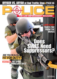 Here's a cover with a photo of two armored SWAT police coming around the corner, with the one in front pointing a huge shotgun obliquely towards the camera.