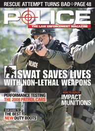 Here's a cover with a photo of a heavily armed SWAT police, with a helmet and body armor, charging directly at the camera with a shotgun pointed directly at the camera, with the headline "SWAT Saves Lives".