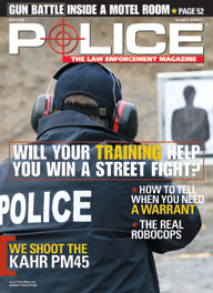 Here's a cover with a photo of a cop aiming a gun at the target on a training range.