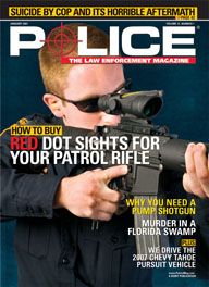 Here's a cover with a photo of a cop in an ordinary blue duty uniform looking through the site of a huge assault rifle, pointed at a target off-camera.