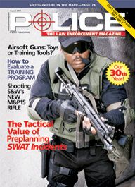 Here's a cover with a photo of a SWAT police in body armor, wearing sunglasses and squared off facing the camera, with a large assault rifle in his hands.