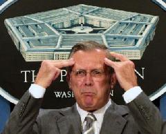 photo: Donald Rumsfeld clutches his head