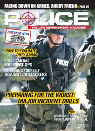 Here's a cover with a photo of an armored SWAT police charging towards the camera, holding an assault rifle that's currently pointed at the ground.