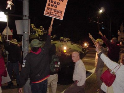 photo: Anti-war demonstrators stopping a tank in the streets