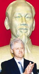photo: Bill Clinton stands in front of a giant statue of Ho Chi Minh